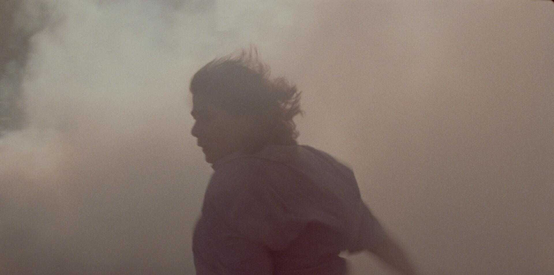 A figure moving through haze in Atonement